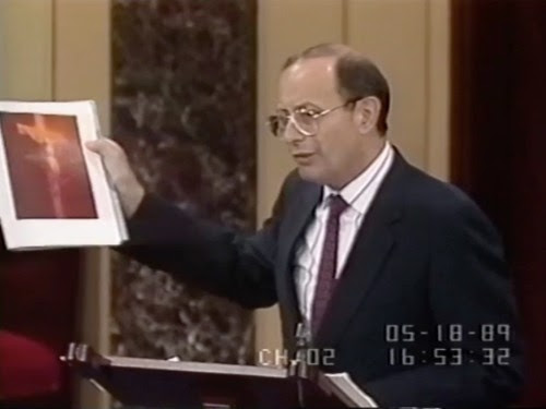 Senator Alphonse D'Amato (R-New York) denouncing NEA funding to Andres Serrano and other artists before congress, May 18, 1989. 